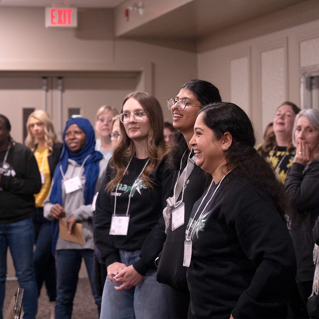 Educators meeting at a conference to discuss early childhood education practices